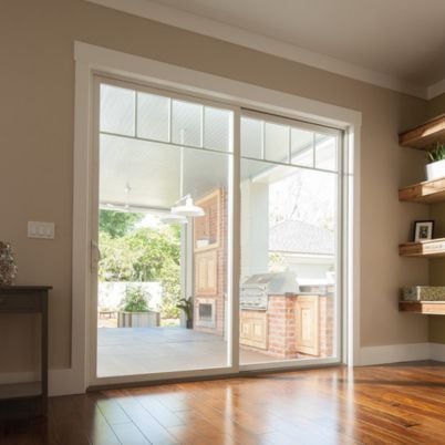 100 series white interior gliding patio door with fractional grilles