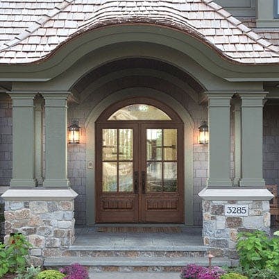 entry door style 181 brown on green stone house